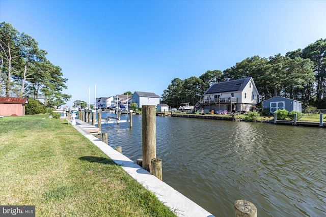 dock area featuring a yard and a water view