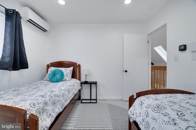 carpeted bedroom featuring a wall unit AC