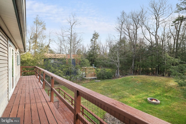 wooden deck with a yard