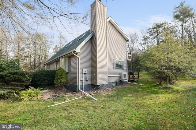 view of property exterior featuring a lawn