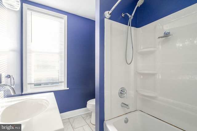 full bathroom featuring toilet, vanity, and  shower combination