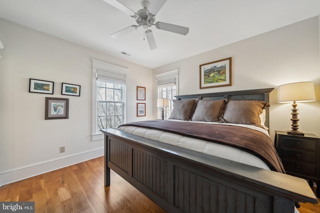 bedroom with ceiling fan and light wood-type flooring