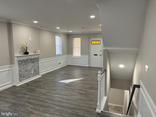 foyer with crown molding and dark hardwood / wood-style flooring