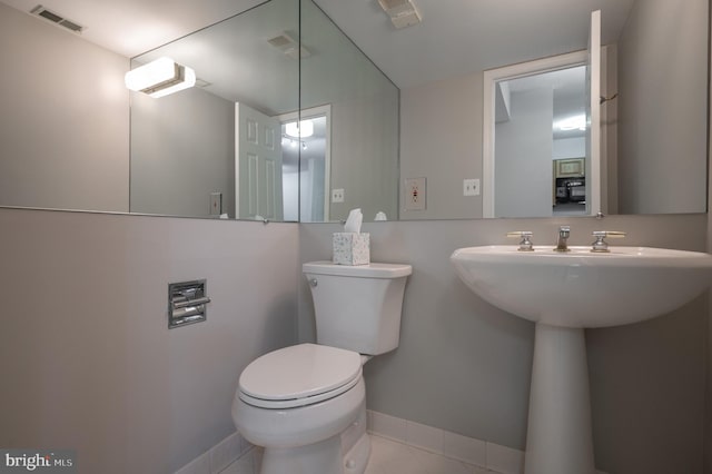 bathroom featuring tile patterned floors, sink, and toilet