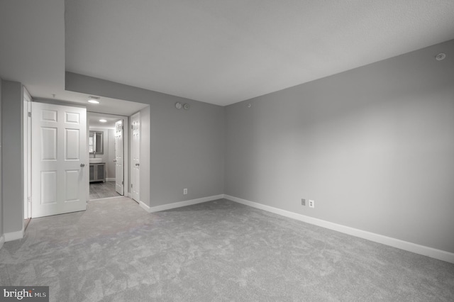 empty room with light colored carpet