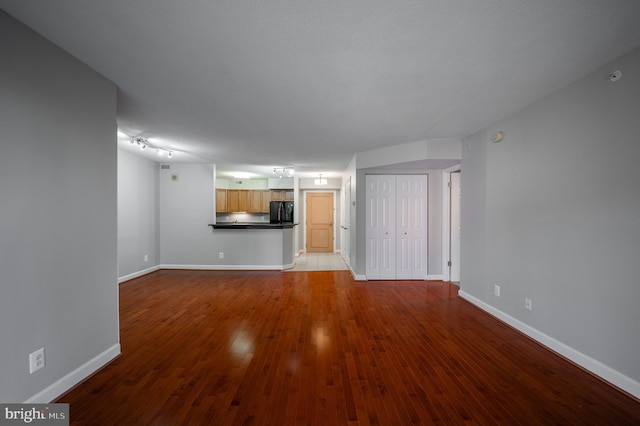 unfurnished living room with light hardwood / wood-style floors