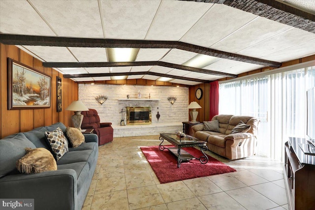 333 W Arch St, Frackville, PA 17931 - living area with wood walls, beamed ceiling, and a brick fireplace