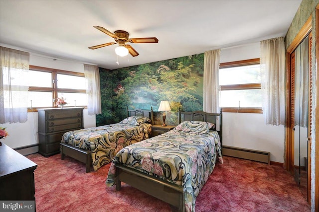 bedroom featuring ceiling fan, multiple windows, and baseboard heating