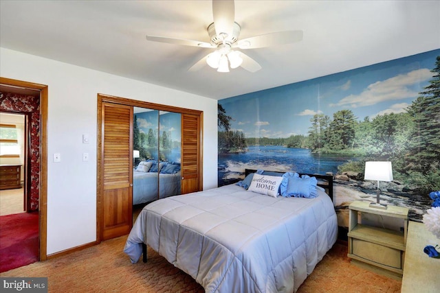 carpeted bedroom with a closet and ceiling fan