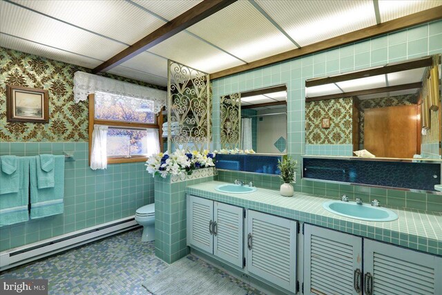 333 W Arch St, Frackville, PA 17931 - bathroom with a baseboard heating unit, tile walls, a sink, and wallpapered walls