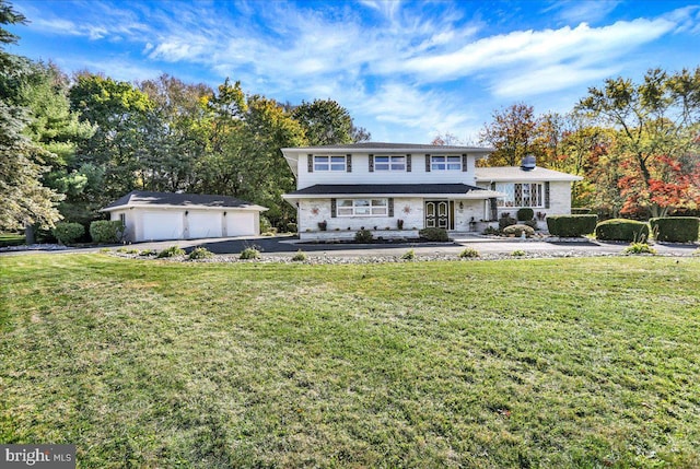 view of front of home with an outdoor structure, a front lawn, and a garage