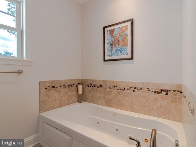 bathroom with a tub to relax in