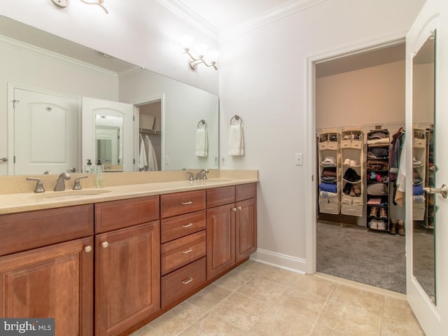 bathroom with vanity, crown molding, and tile patterned floors