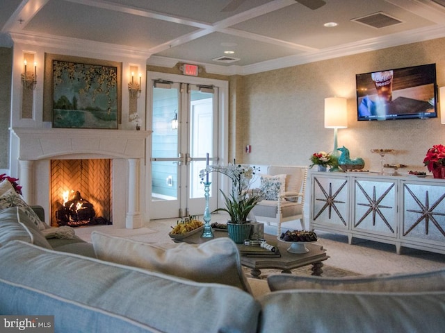 living room featuring ornamental molding and coffered ceiling