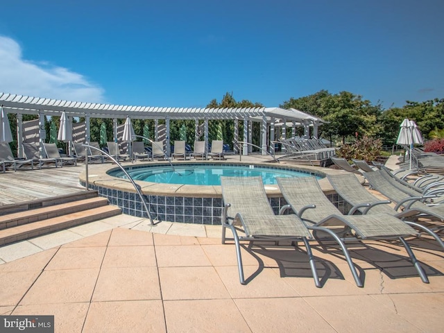 view of pool featuring a patio and a pergola