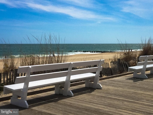 exterior space with a water view and a view of the beach