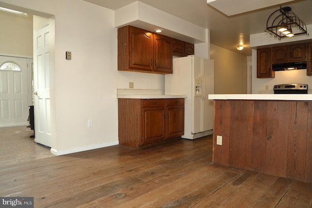 kitchen with electric range, white refrigerator with ice dispenser, and dark hardwood / wood-style floors