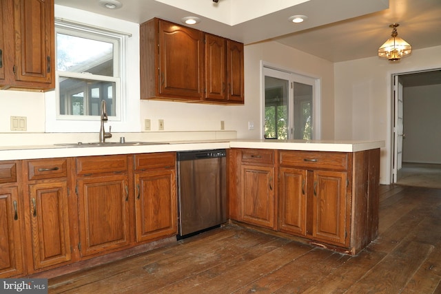 kitchen featuring sink, dishwasher, dark wood-type flooring, and kitchen peninsula