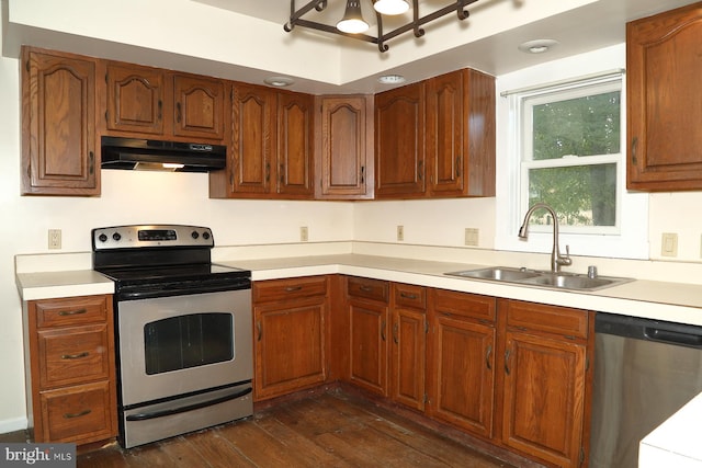 kitchen with sink, dark wood-type flooring, and stainless steel appliances