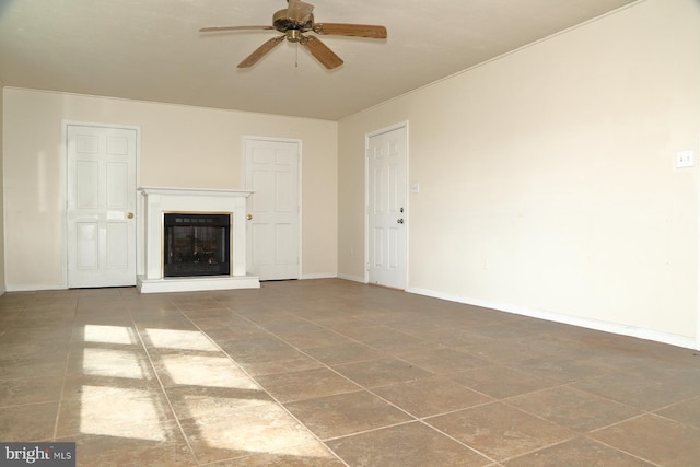 unfurnished living room with ceiling fan