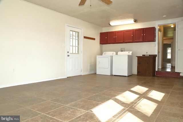 clothes washing area with cabinets, sink, washing machine and dryer, and ceiling fan