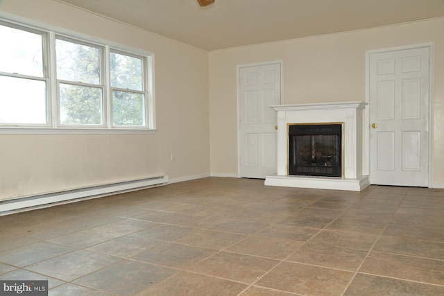 unfurnished living room with a baseboard heating unit