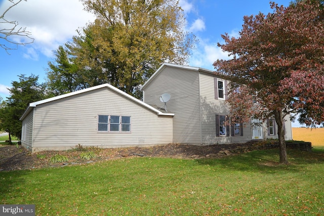 view of property exterior featuring a yard