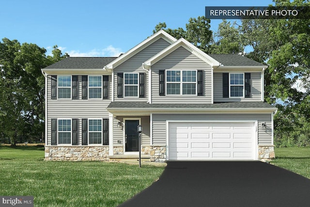 view of front facade with a front lawn and a garage