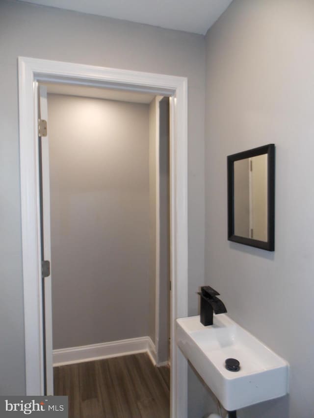 interior space featuring dark wood-type flooring and sink