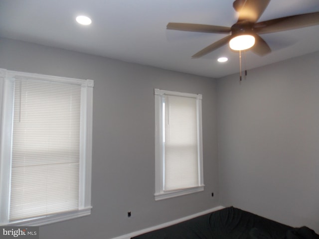 unfurnished room with ceiling fan