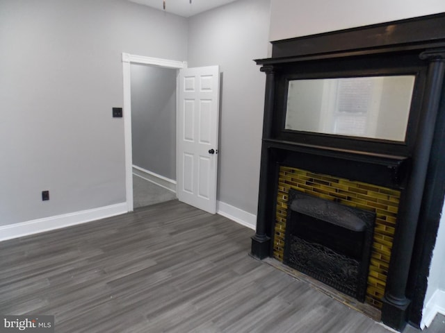 unfurnished living room with hardwood / wood-style flooring