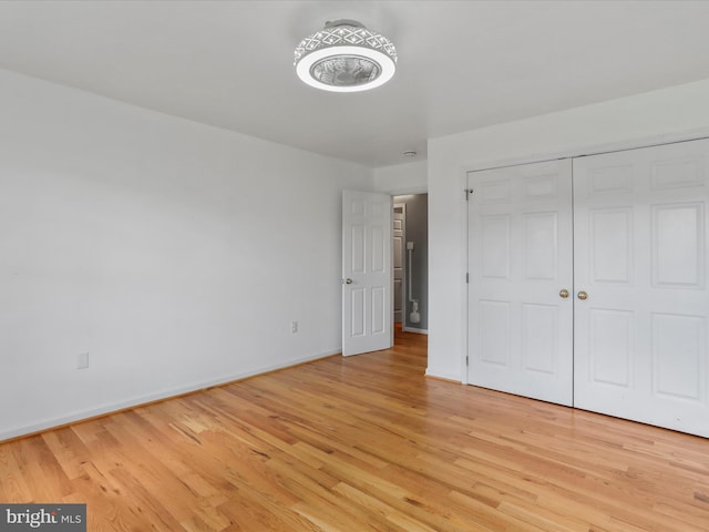 unfurnished bedroom featuring light wood-type flooring