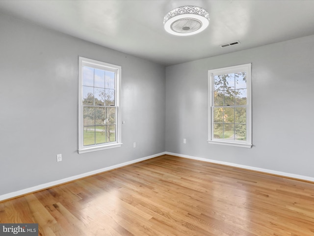 spare room featuring light hardwood / wood-style floors