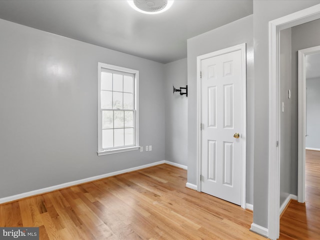 spare room with light hardwood / wood-style floors