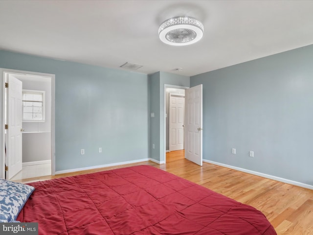 bedroom featuring hardwood / wood-style floors