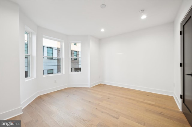 unfurnished room featuring light hardwood / wood-style floors