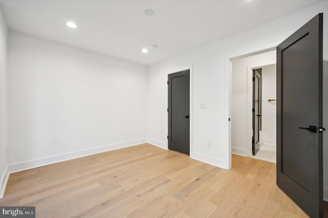 spare room with light hardwood / wood-style floors