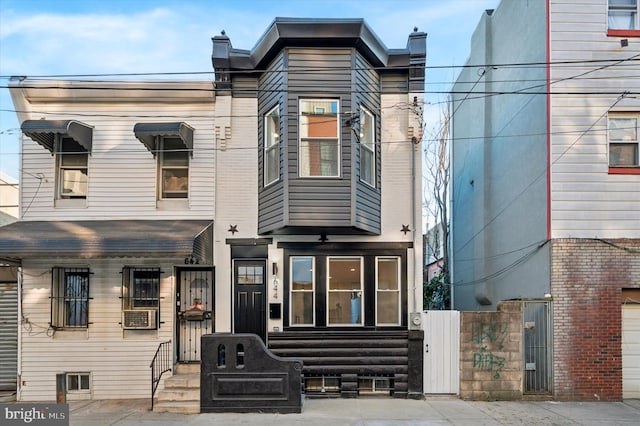 view of front of property featuring cooling unit