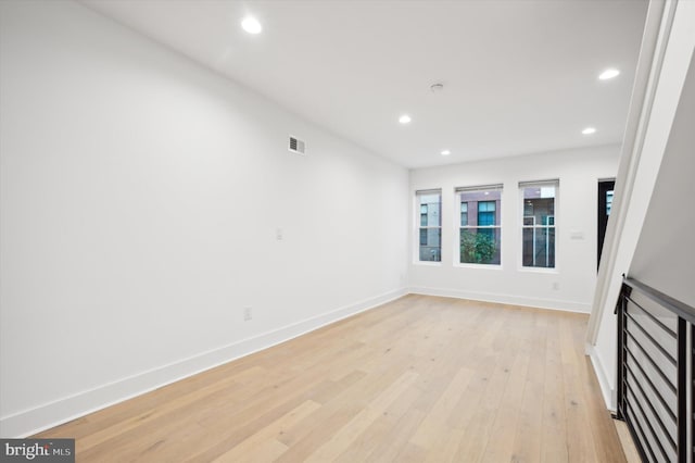 unfurnished living room with light hardwood / wood-style flooring