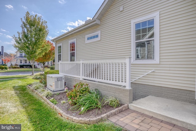 view of home's exterior with a lawn