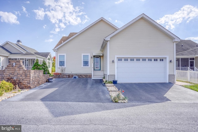 view of front of property with a garage