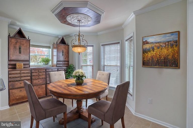 tiled dining space featuring ornamental molding