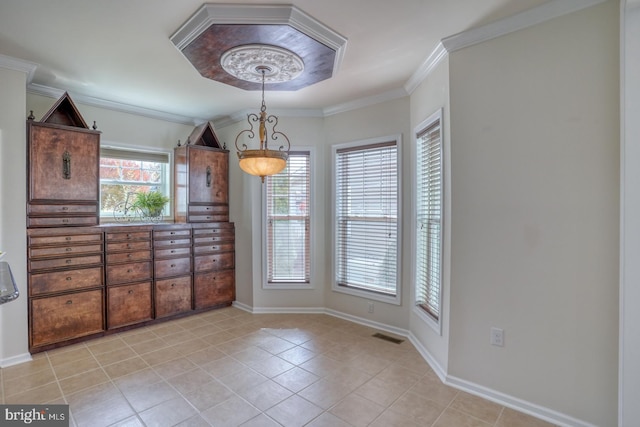 unfurnished dining area featuring crown molding and light tile patterned floors