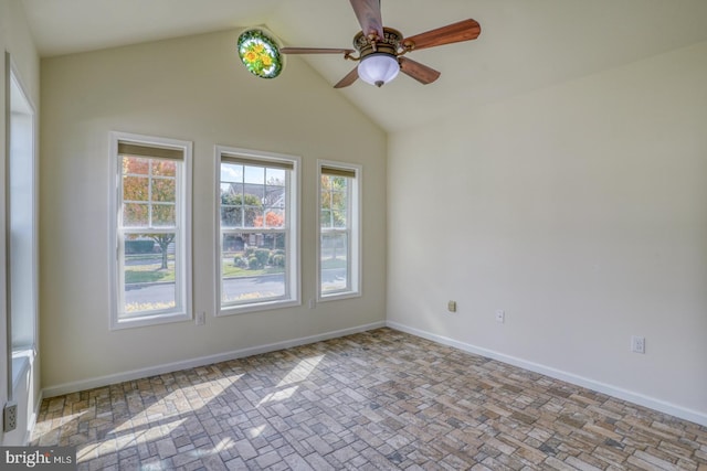 spare room featuring ceiling fan and high vaulted ceiling