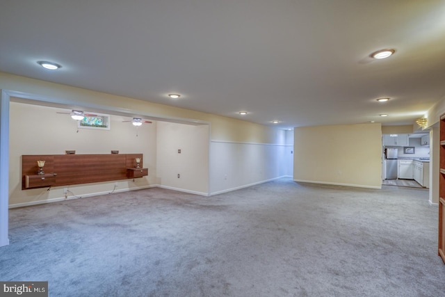 interior space with carpet floors and stainless steel fridge