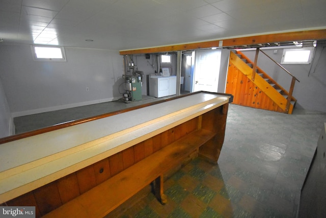 bar featuring washer and dryer and plenty of natural light