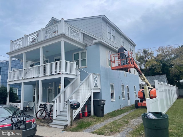 view of front of property with a balcony and a porch