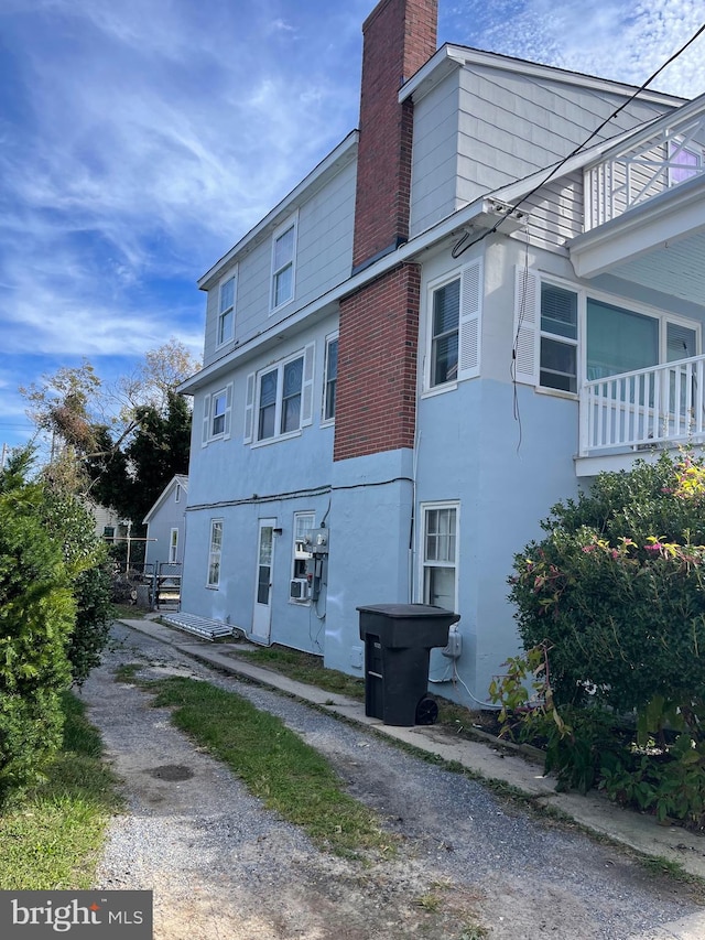 view of property exterior with a balcony