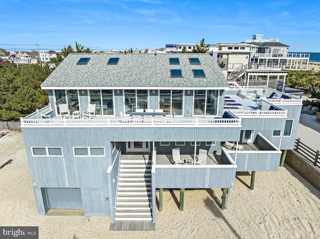 1039 Long Beach Blvd, Long Beach Township, NJ 08008 - rear view of house featuring stairs and a shingled roof