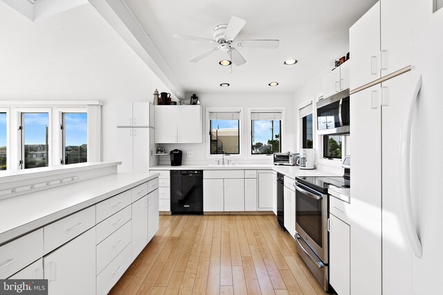 1039 Long Beach Blvd, Long Beach Township, NJ 08008 - kitchen with appliances with stainless steel finishes, a sink, white cabinets, recessed lighting, and a ceiling fan